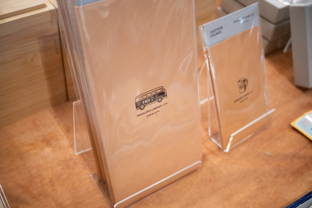 TRAVELER'S FACTORY leather folders on a TRC tablecloth at the California Pen Show.