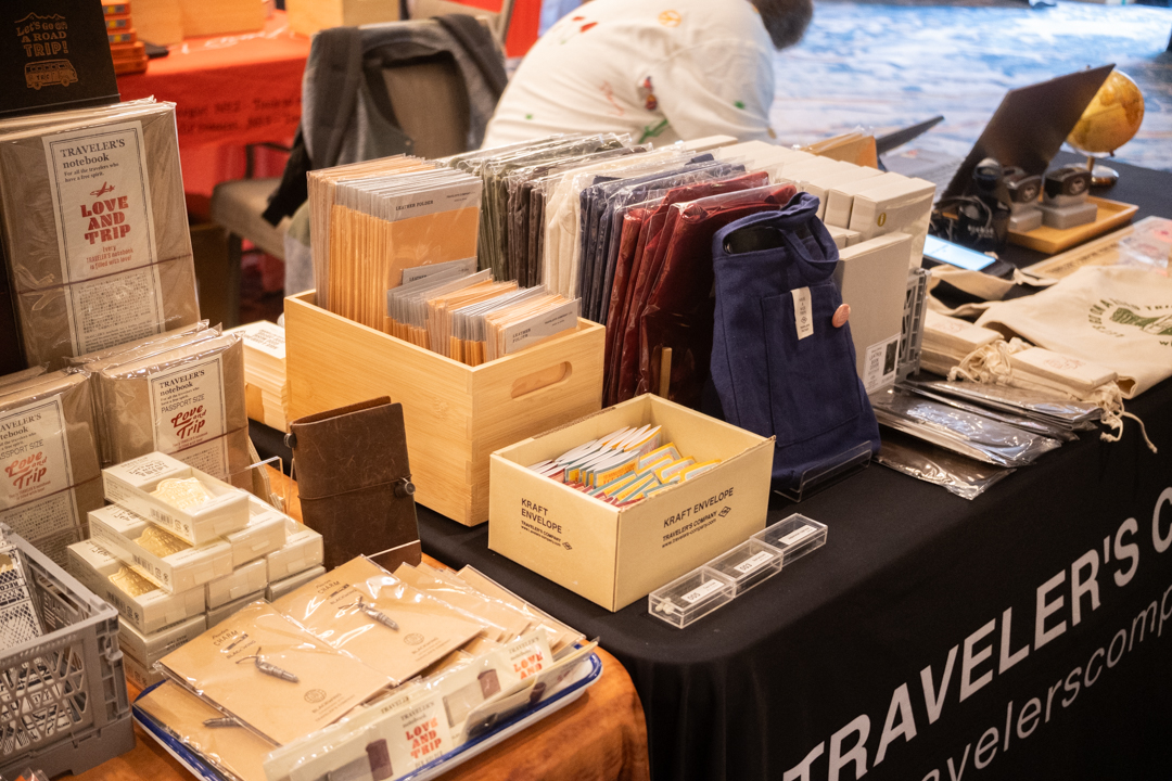 Fully stocked notebooks and other stationery at the TRAVELER'S COMPANY USA table at the California pen show.
