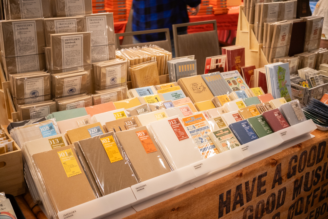 Fully stocked notebooks and other stationery at the TRAVELER'S COMPANY USA table at the California pen show.