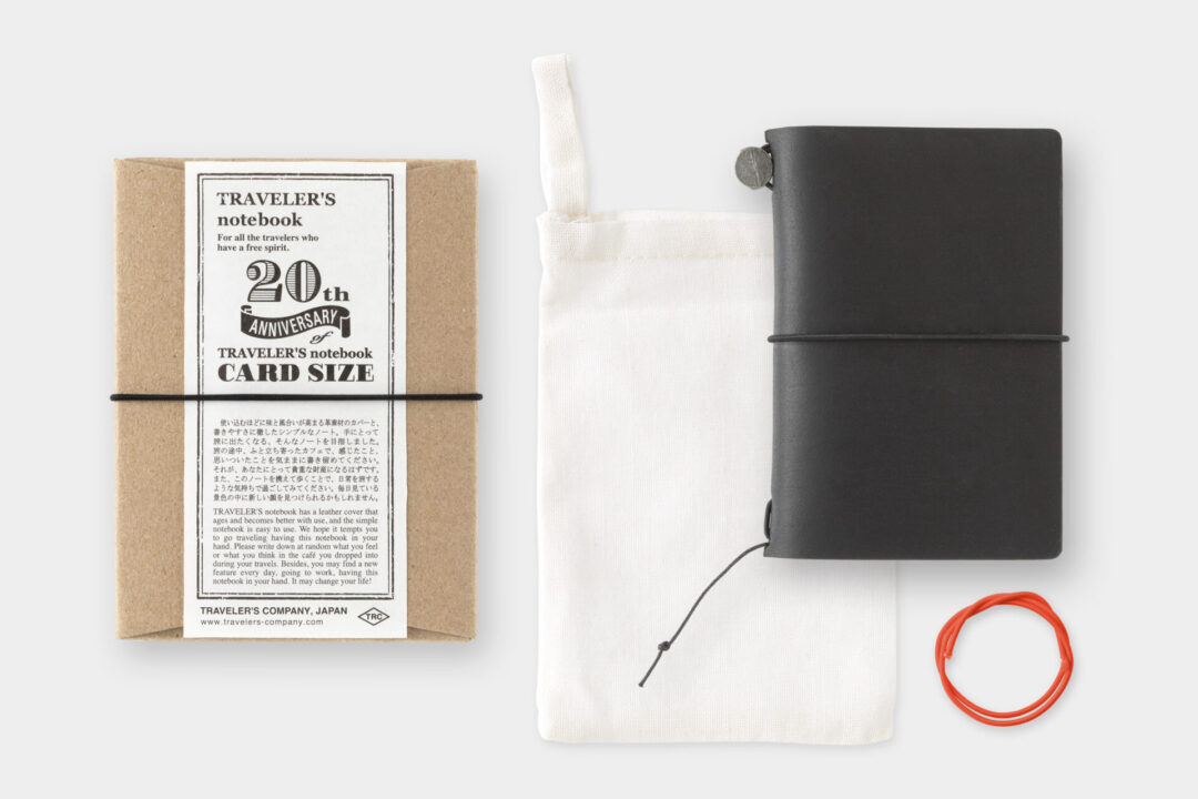 TRAVELER'S notebook Card Size Black with cotton bag and spare rubber band.