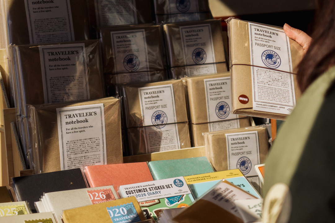 A close-up of the TRC USA table, which is filled with TRAVELER'S notebooks.