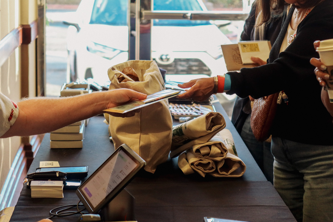 People shopping TRAVELER’S COMPANY and TRAVELER'S FACTORY items at the TRC USA table at the SF Stationery Fest.