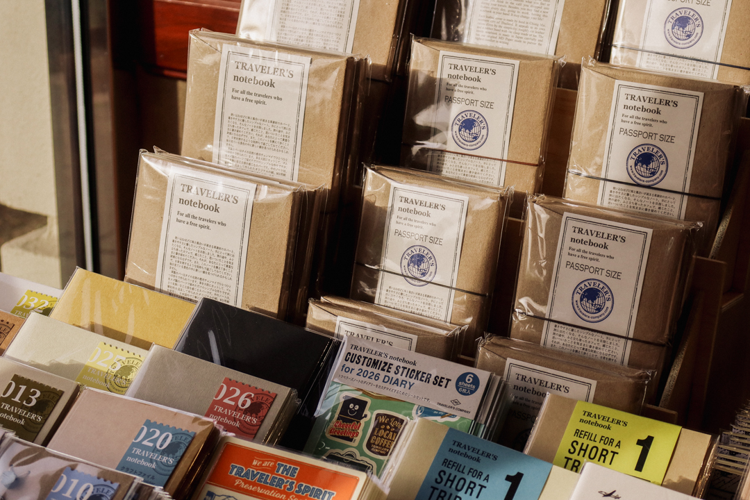 A close-up of the TRC USA table, which is filled with TRAVELER'S notebooks.