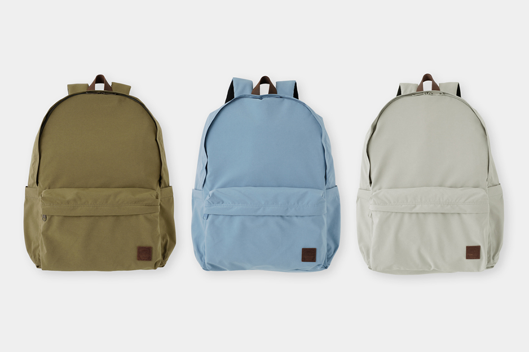 TF TO&FRO Standard Backpack in olive, blue, and greige.