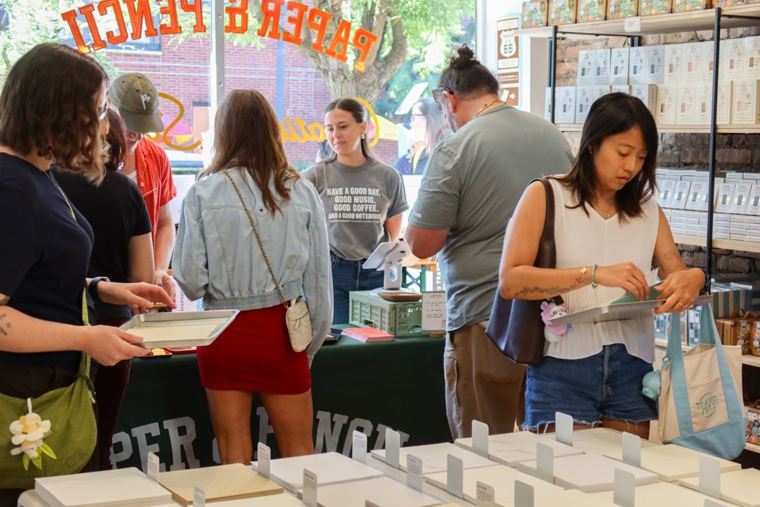 Customers enjoying the DIY TRAVELER'S notebook! workshop inside Paper & Pencil store.