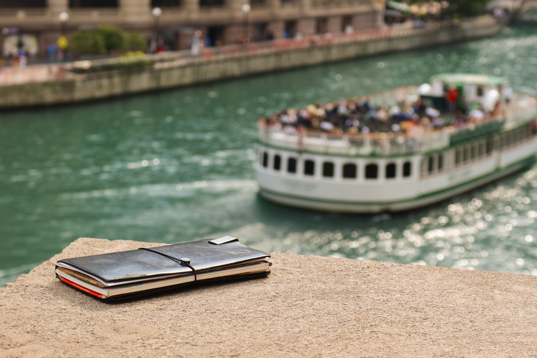 TRAVELER'S notebook next to Chicago riverfront walk.