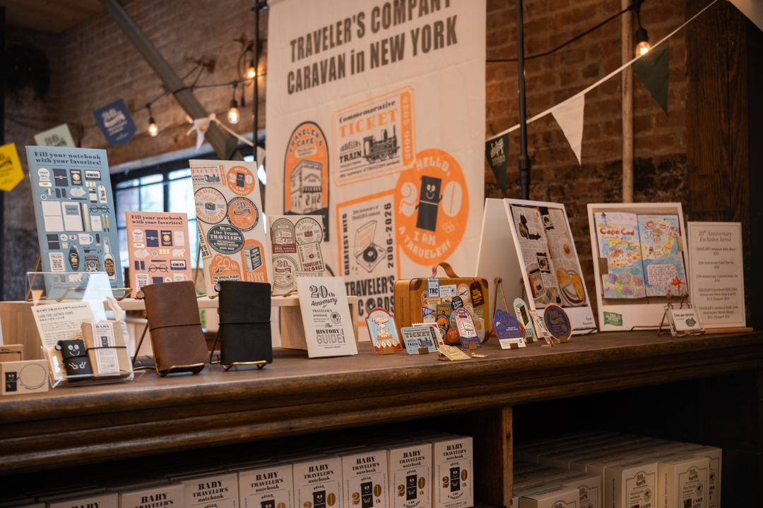 The display of TRAVELER'S COMPANY 20th Anniversary items on top of a display shelf.
