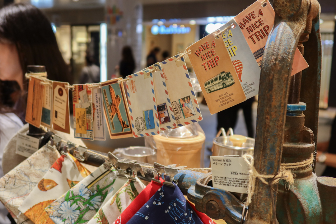 The interior of TRAVELER'S FACTORY STATION filled with TRAVELER'S notebooks, inserts, stationery, and travel memorabilia.