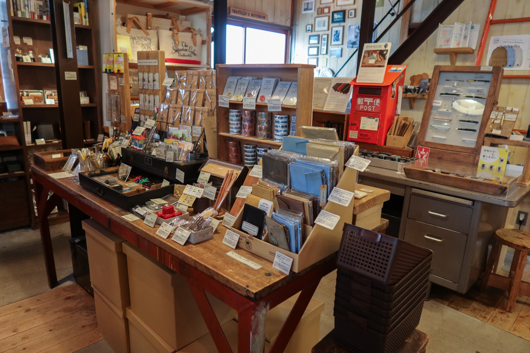 The interior of TRAVELER'S FACTORY Nakameguro filled with TRAVELER'S notebooks, inserts, stationery, and travel memorabilia.