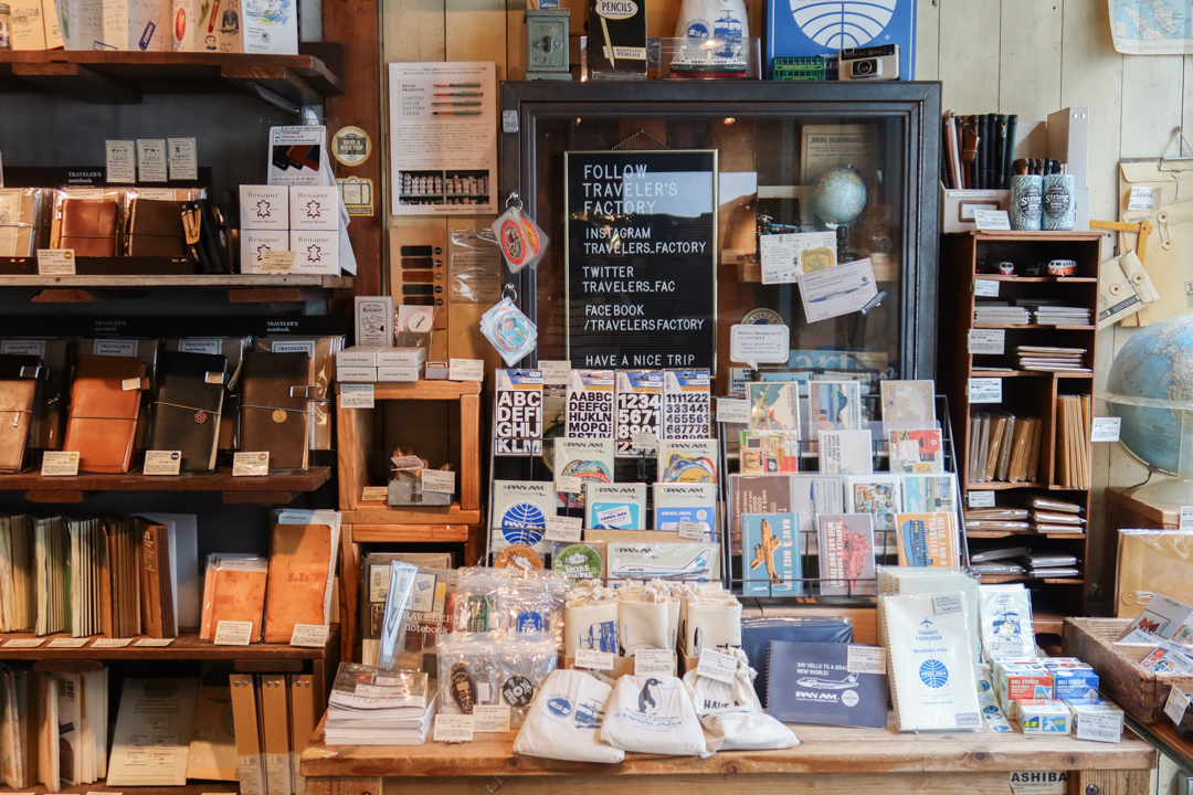 The interior of TRAVELER'S FACTORY Nakameguro filled with TRAVELER'S notebooks, inserts, stationery, and travel memorabilia.