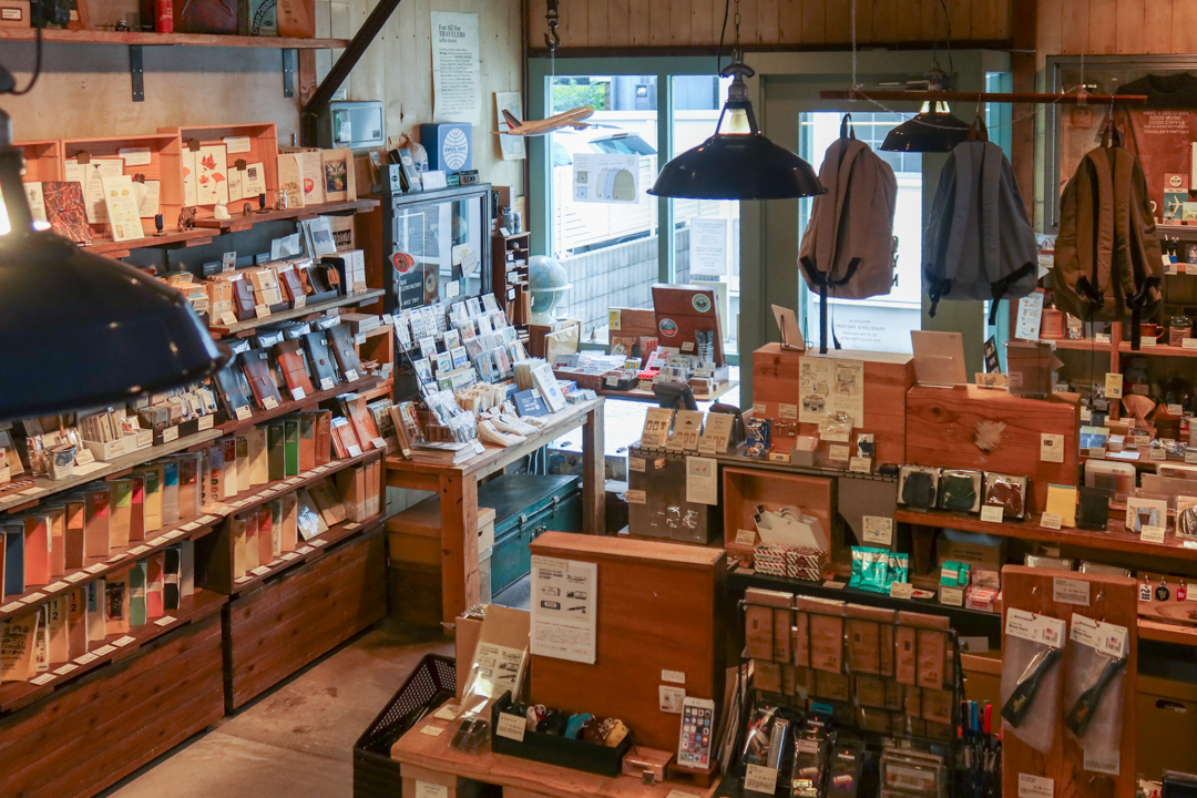The interior of TRAVELER'S FACTORY Nakameguro filled with TRAVELER'S notebooks, inserts, stationery, and travel memorabilia.